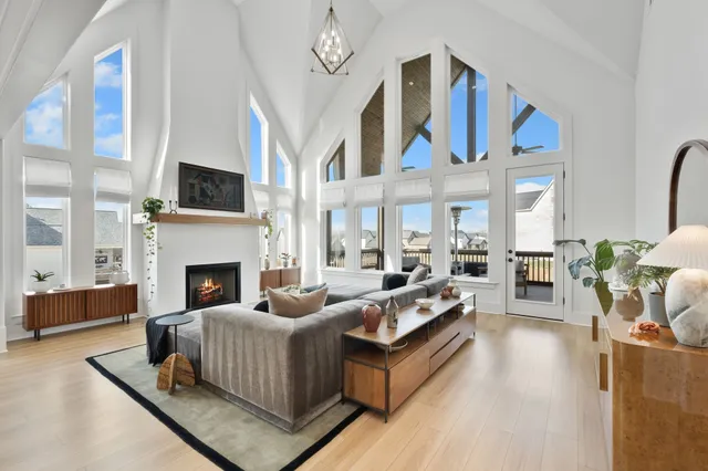 a living room with furniture fireplace and flat screen tv
