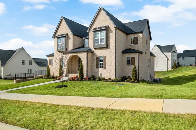 a front view of a house with a yard