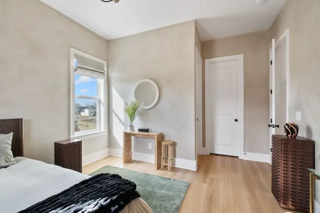 a bedroom with a bed and a dresser