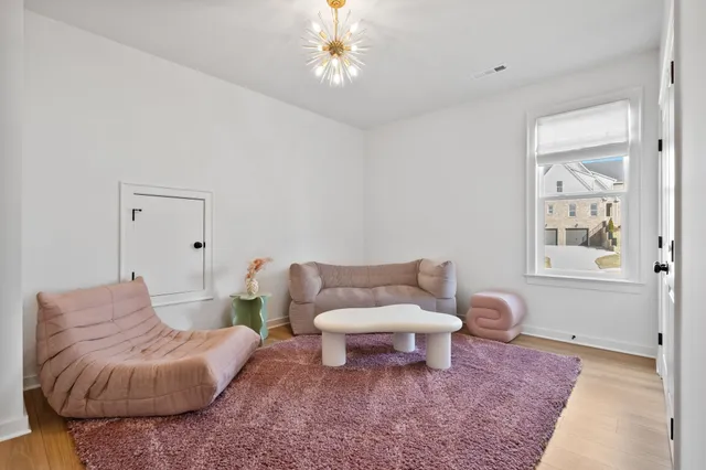a living room with furniture and a rug