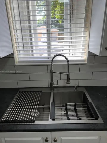a closeup of a sink and window
