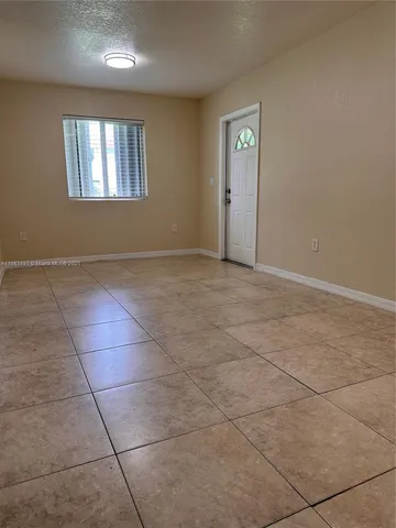 a view of an empty room and window shelves