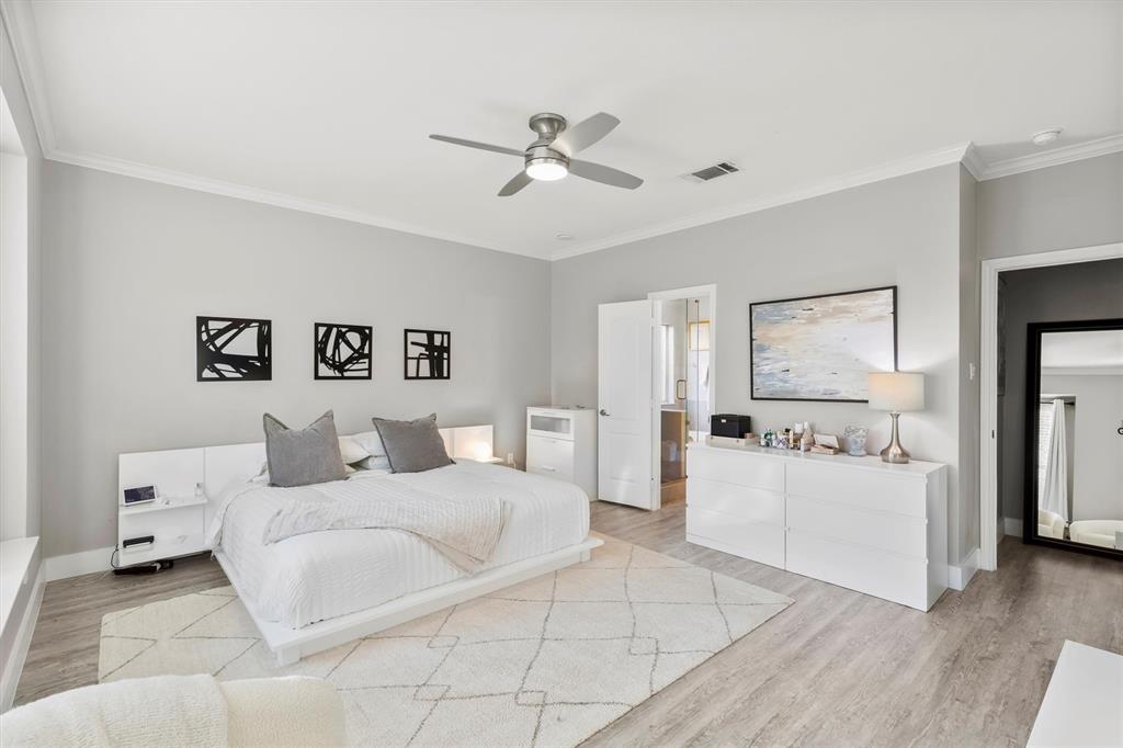 4008 Sherry Lane Addison, TX 75001 - Photo 13 of 39 a bedroom with a white bed and white walls