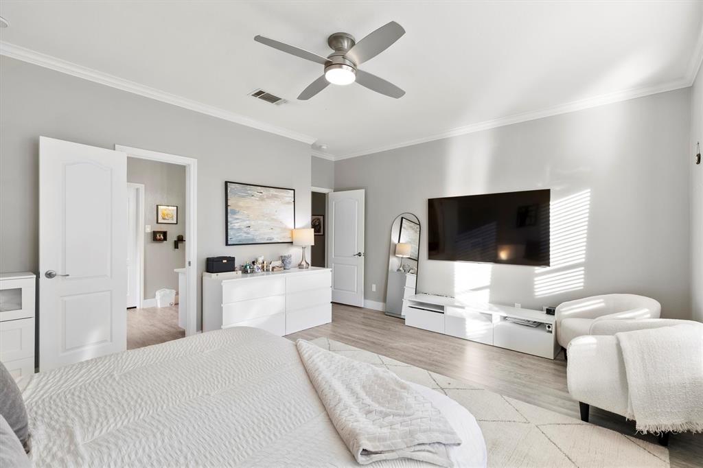 4008 Sherry Lane Addison, TX 75001 - Photo 15 of 39 a bedroom with a bed and a flat screen tv