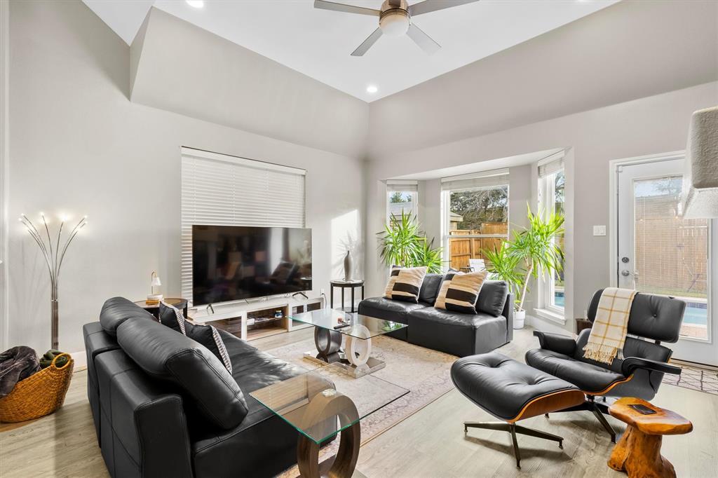 4008 Sherry Lane Addison, TX 75001 - Photo 2 of 39 a living room with furniture and a flat screen tv
