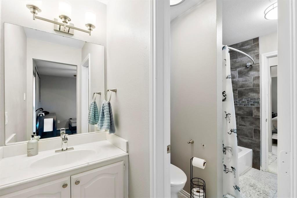 4008 Sherry Lane Addison, TX 75001 - Photo 24 of 39 a bathroom with a sink toilet and shower