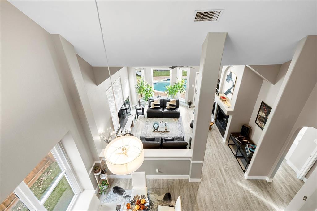 4008 Sherry Lane Addison, TX 75001 - Photo 26 of 39 a living room with furniture and a large window