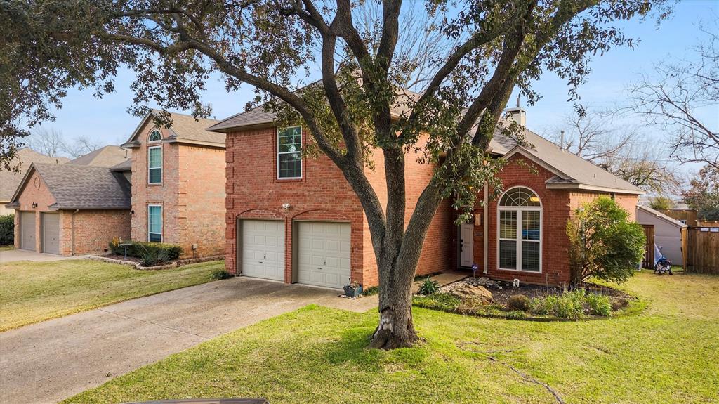 4008 Sherry Lane Addison, TX 75001 - Photo 29 of 39 a view of a white house with a yard and large tree