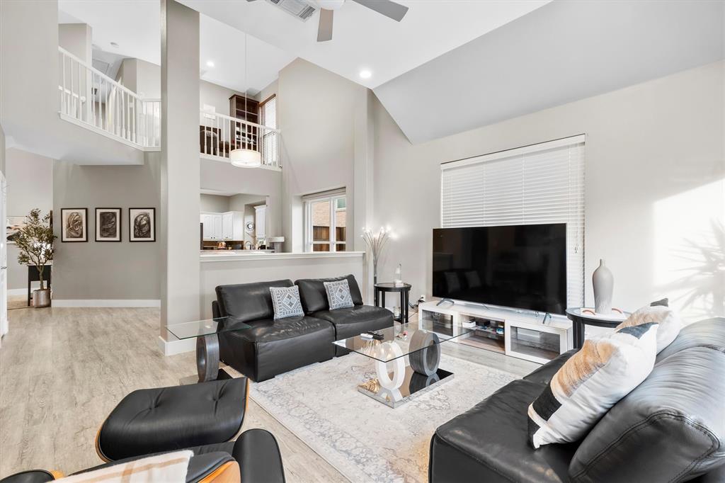 4008 Sherry Lane Addison, TX 75001 - Photo 4 of 39 a living room with furniture and a flat screen tv