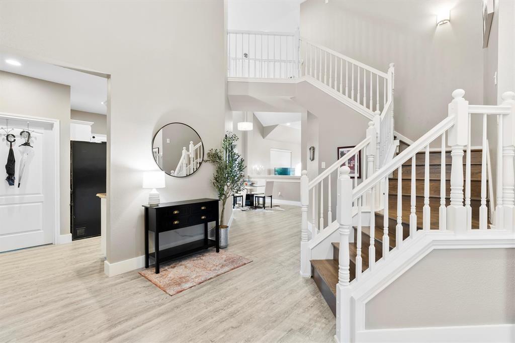 4008 Sherry Lane Addison, TX 75001 - Photo 8 of 39 a view of entryway and hall with wooden floor