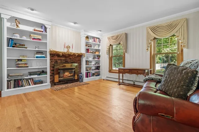 a bedroom with a large bed and a fireplace