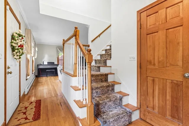 a living room with furniture and a dresser