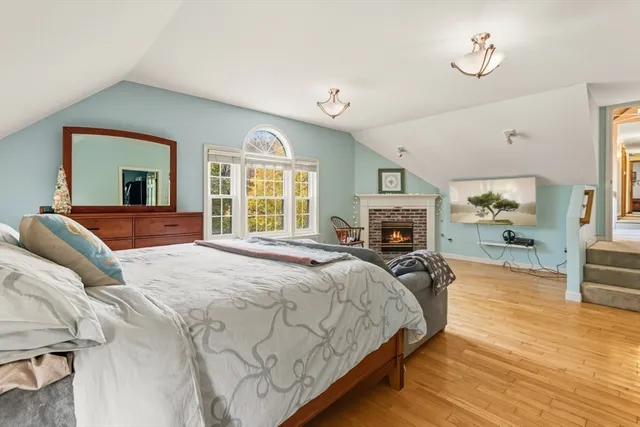 a bathroom with a tub a toilet and a shower