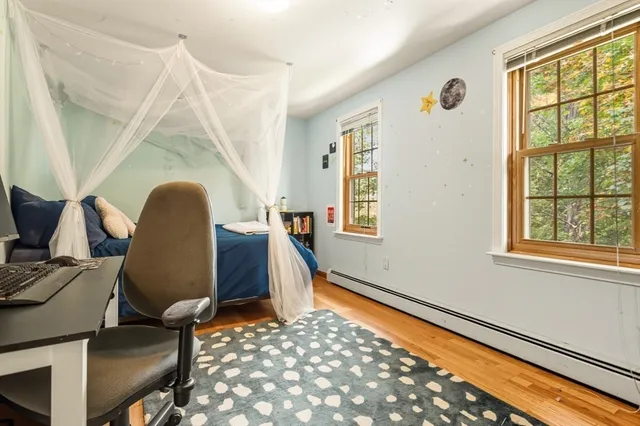 a bedroom with furniture and a gym equipment