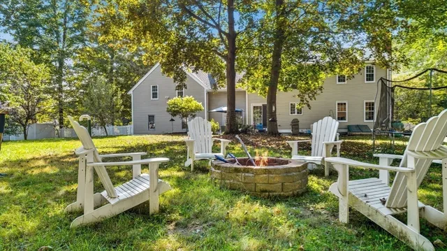 a view of a house with swimming pool and sitting area