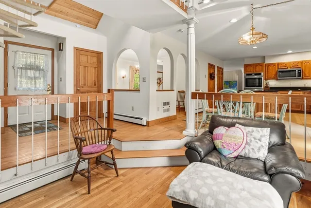 a view of a dining room with furniture and wooden floor