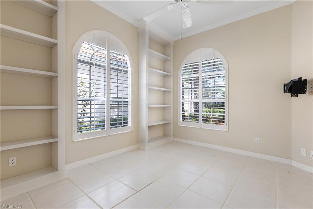 3888 Valentia Way Naples, FL 34119 - Photo 16 of 48 a view of an empty room with a window