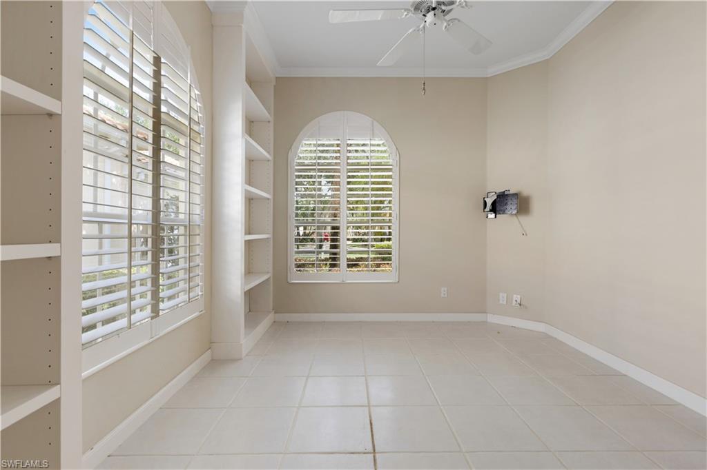 3888 Valentia Way Naples, FL 34119 - Photo 17 of 48 a view of an empty room with a window