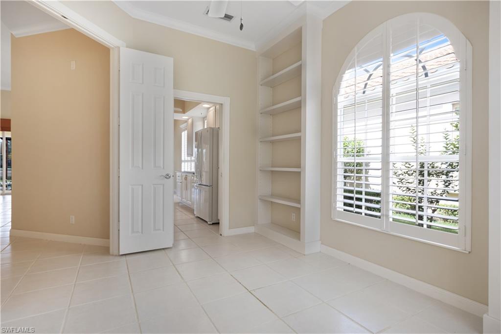 3888 Valentia Way Naples, FL 34119 - Photo 18 of 48 a view of an empty room with a window