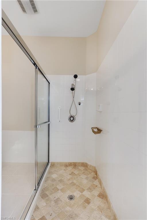 3888 Valentia Way Naples, FL 34119 - Photo 20 of 48 a view of a room with rack on the wall