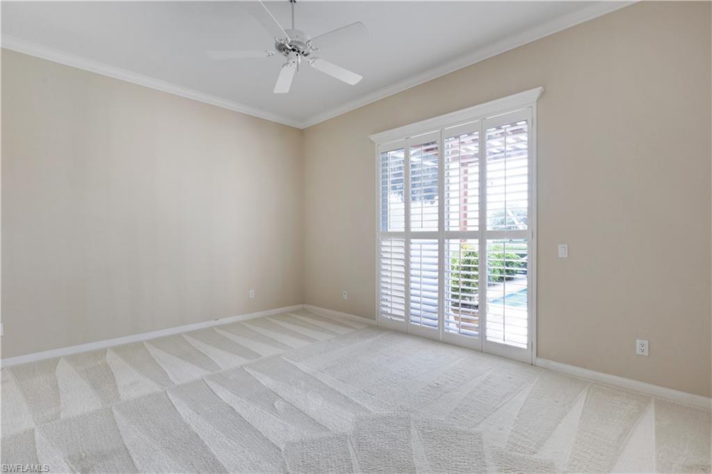 3888 Valentia Way Naples, FL 34119 - Photo 25 of 48 a view of an empty room with a window