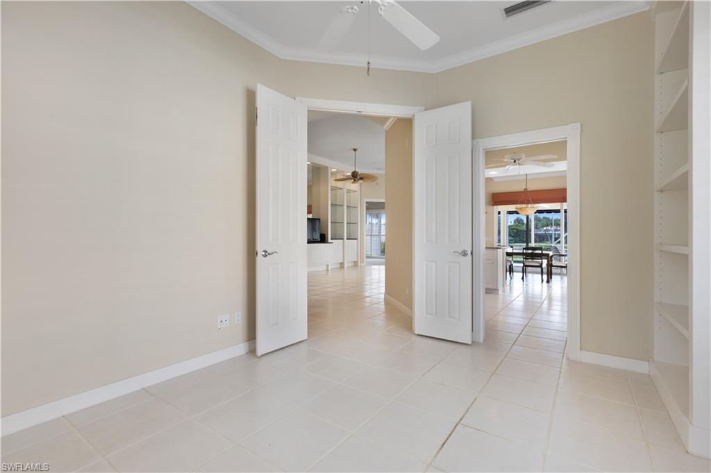 3888 Valentia Way Naples, FL 34119 - Photo 26 of 48 a view of a hallway with wooden floor windows and livingroom