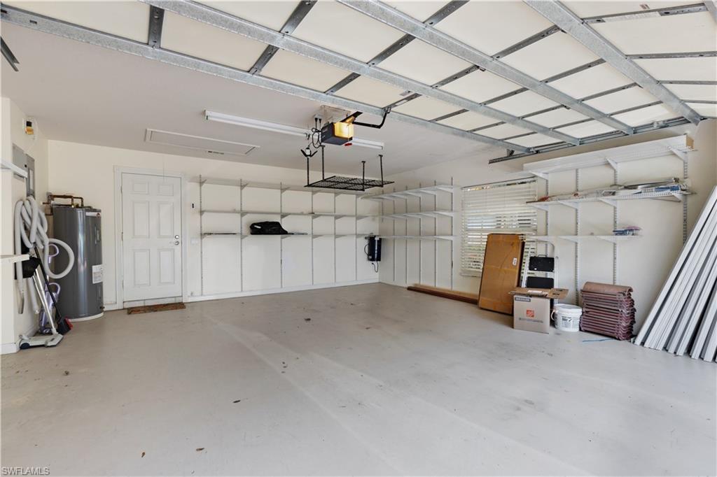 3888 Valentia Way Naples, FL 34119 - Photo 33 of 48 a view of a garage with furniture