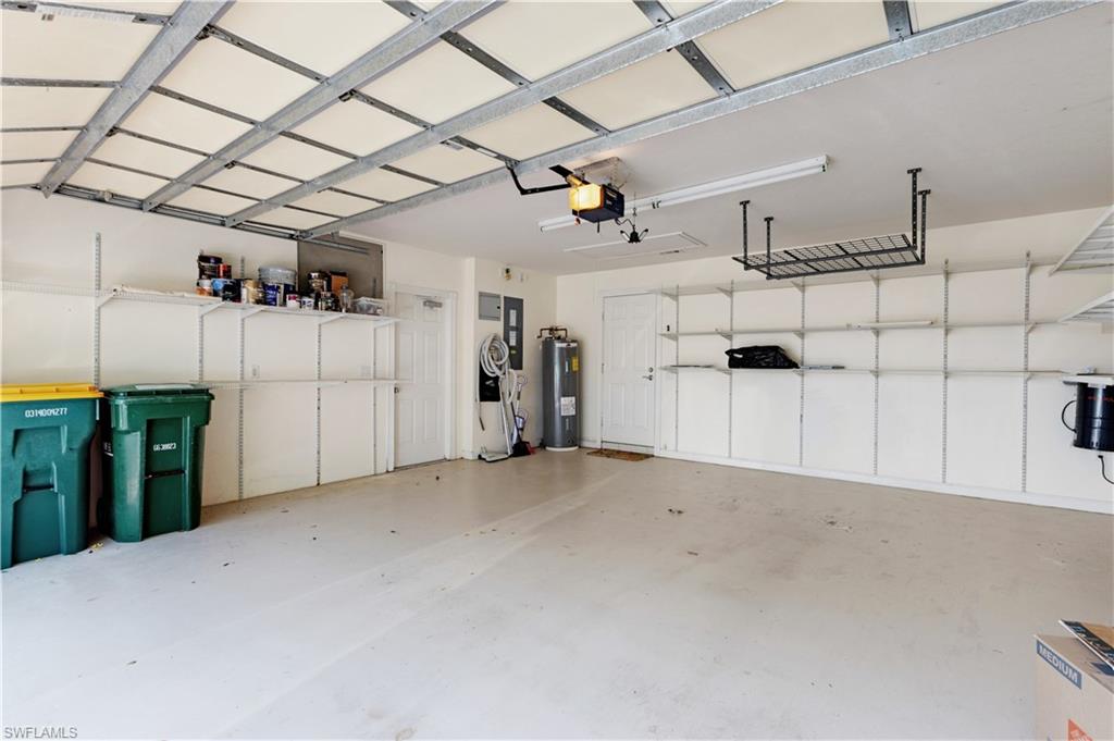 3888 Valentia Way Naples, FL 34119 - Photo 34 of 48 a view of a garage