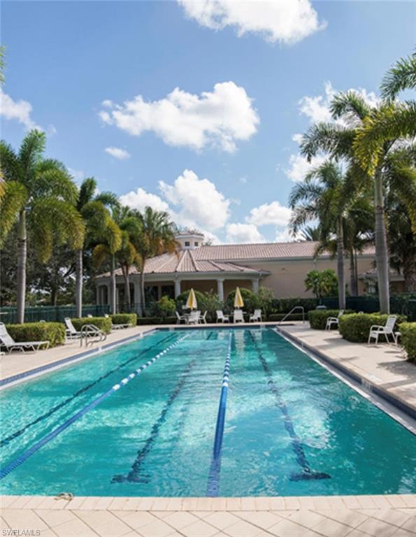 3888 Valentia Way Naples, FL 34119 - Photo 44 of 48 a view of a house with swimming pool and sitting area