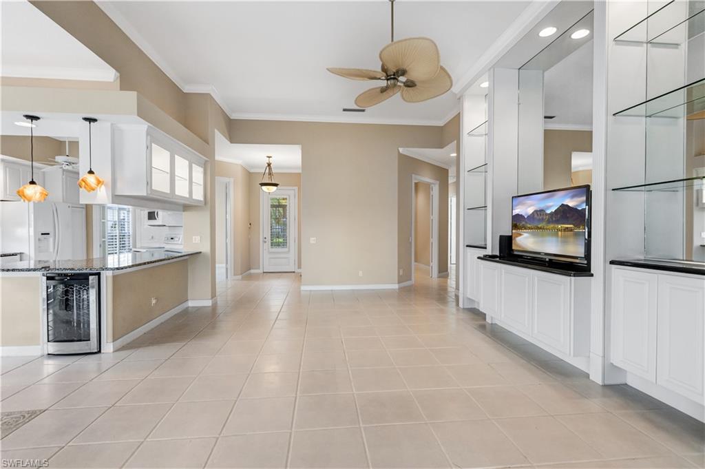 3888 Valentia Way Naples, FL 34119 - Photo 10 of 48 a view of kitchen with stainless steel appliances granite countertop a refrigerator and a stove top oven