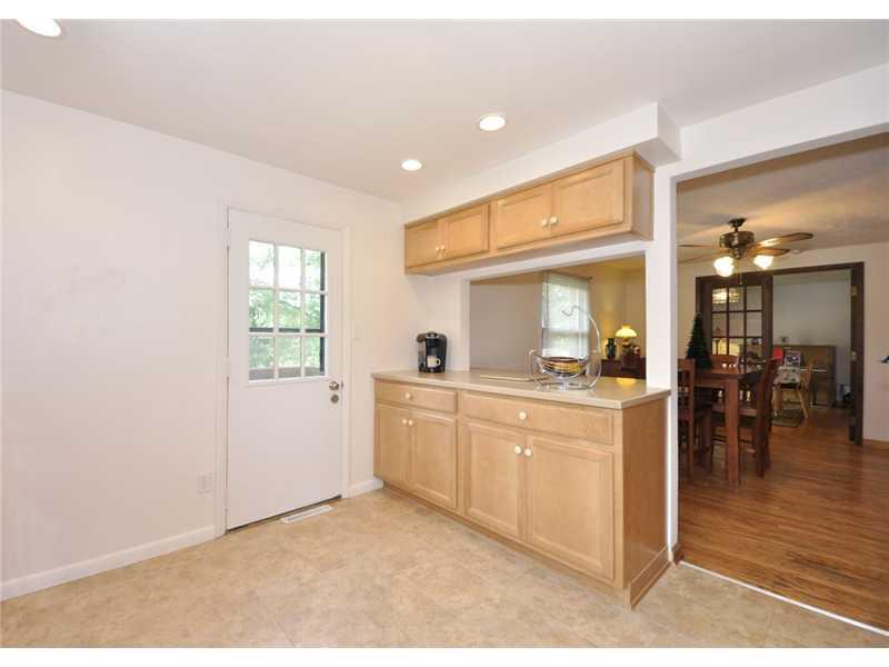 2745 Cole Road Wexford, PA 15090 - Photo 4 of 20 Kitchen. Neurtal Kitchen showing DR and breakfast counter. Couild be used for morning coffee and entertaining. Door offers access to the deck extending across the back of home.