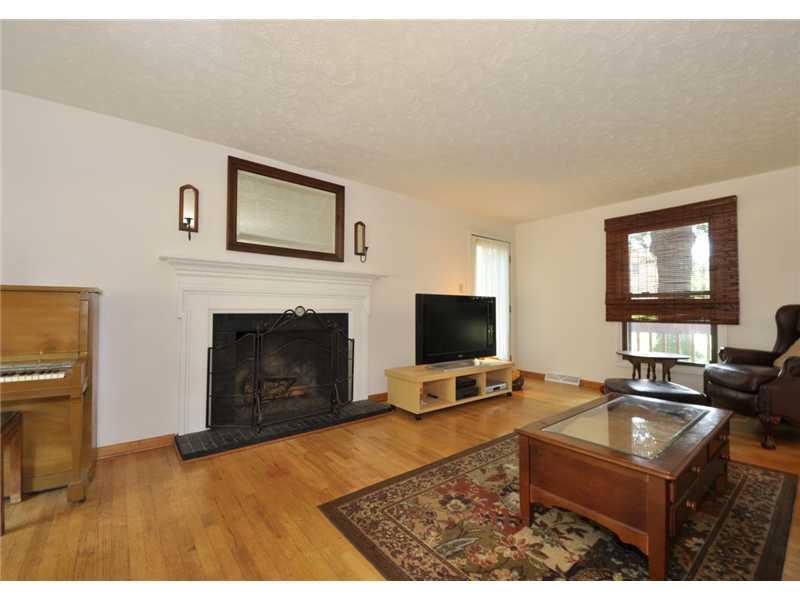 2745 Cole Road Wexford, PA 15090 - Photo 8 of 20 Living Room. LR/GR showing fireplace with pretty mantle and door opening to side deck.