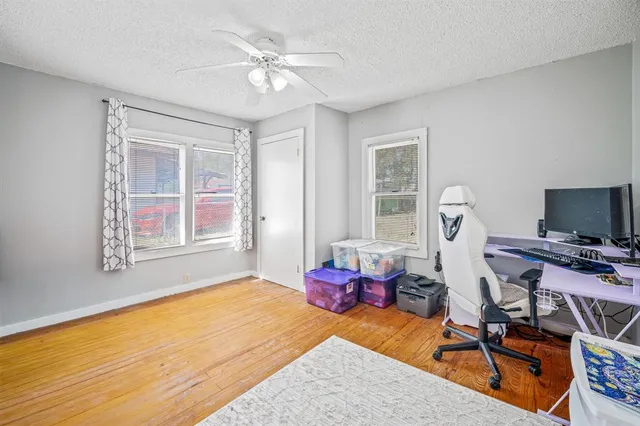 a bedroom with furniture and a window