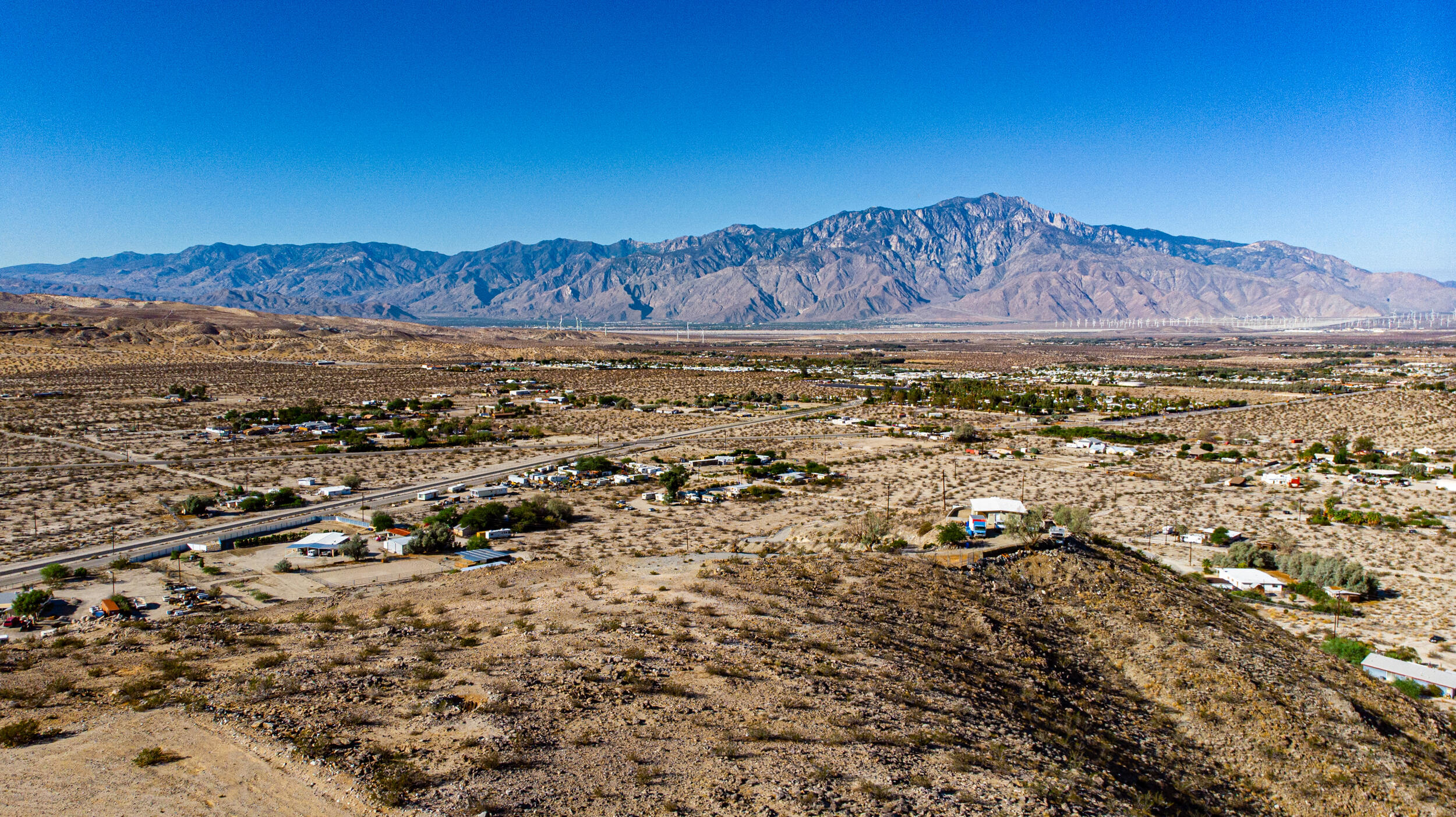 71690 Channel Run Road Desert Hot Springs, CA 92241 - Photo 16 of 18 an aerial view of a house with a yard