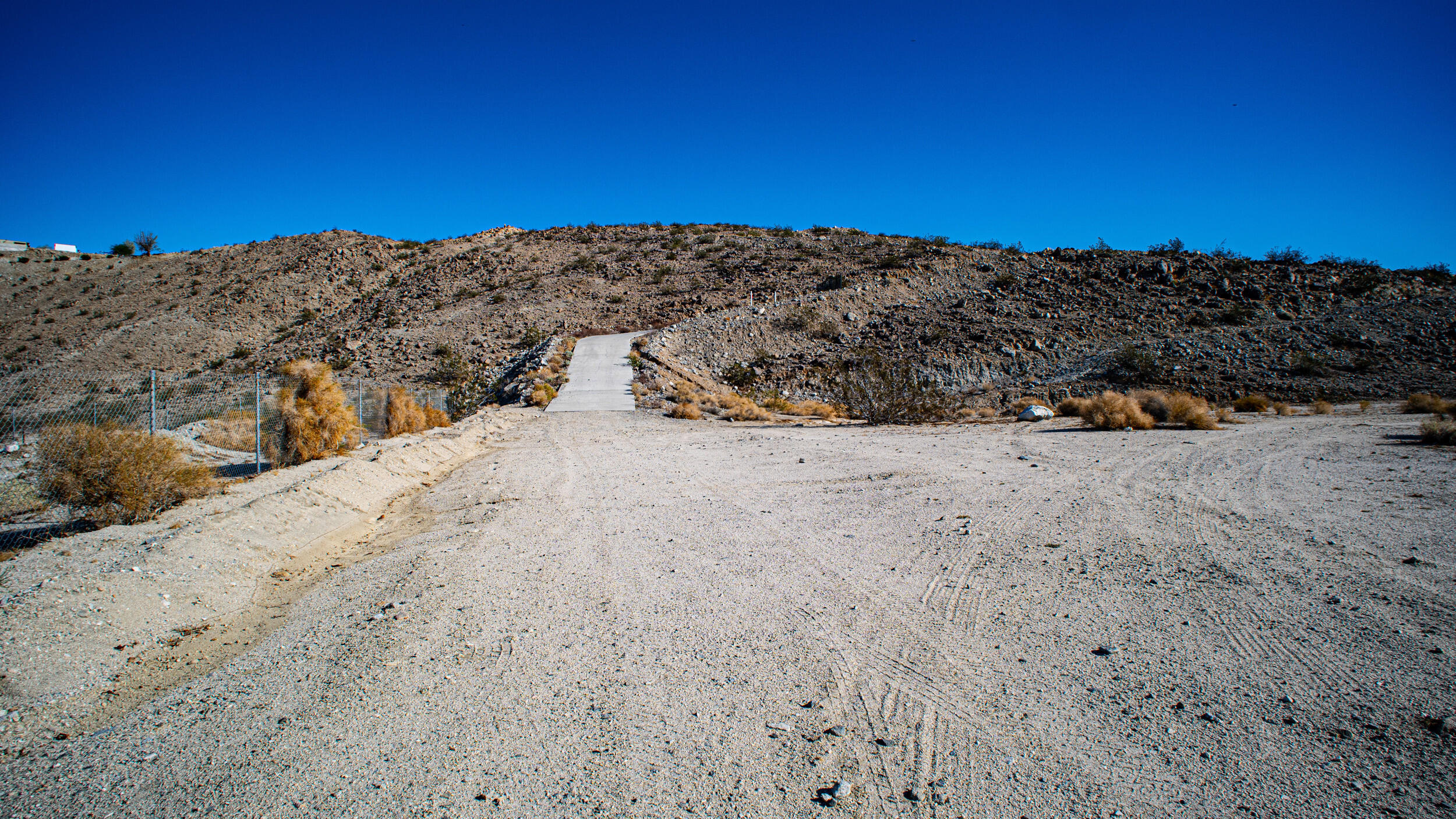 71690 Channel Run Road Desert Hot Springs, CA 92241 - Photo 2 of 18 a view of outdoor space and mountain view