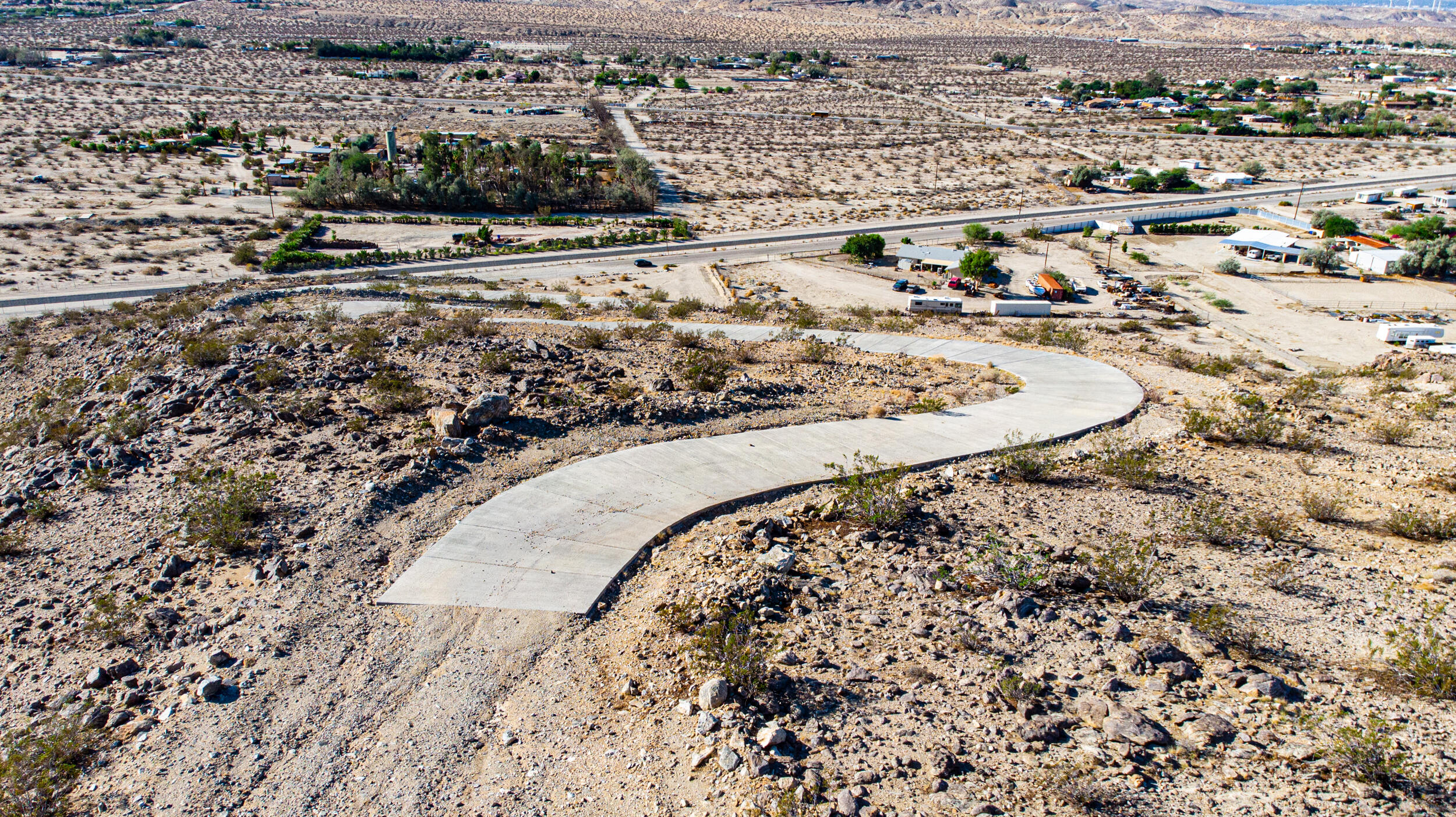 71690 Channel Run Road Desert Hot Springs, CA 92241 - Photo 6 of 18 an aerial view of a house with a yard