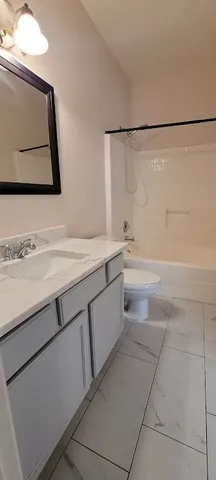 a bathroom with a sink a vanity and a mirror