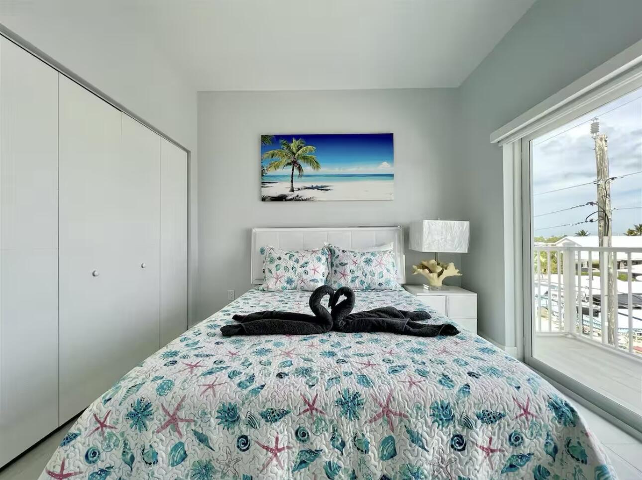 1021 82nd Street Marathon, FL 33050 - Photo 18 of 33 a bedroom with a bed and window