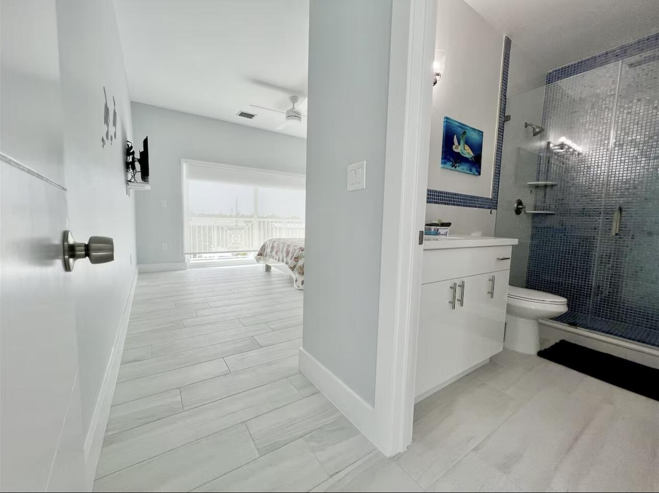 1021 82nd Street Marathon, FL 33050 - Photo 21 of 33 a bathroom with a sink a toilet and shower