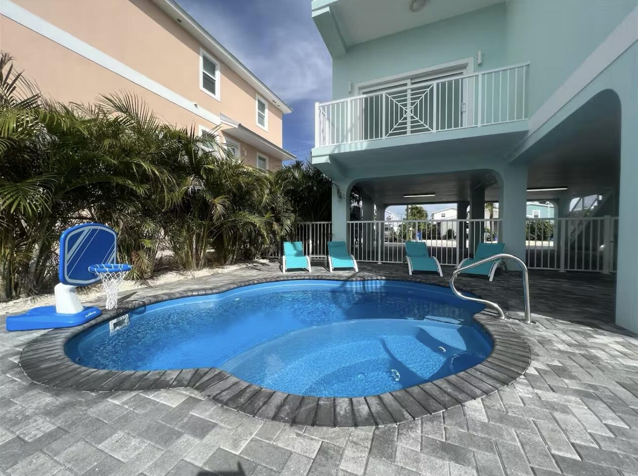 1021 82nd Street Marathon, FL 33050 - Photo 27 of 33 a view of a house with swimming pool and sitting area