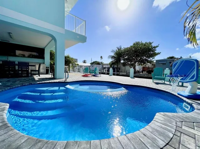a view of swimming pool with outdoor seating