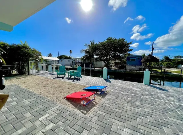 a lake with lots of palm trees