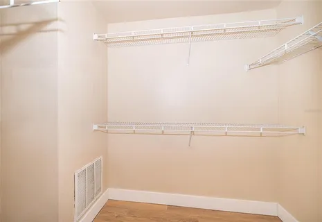 a view of a room with racks on the wall