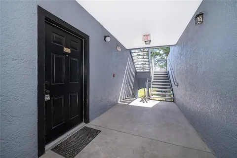 a view of an empty room with stairs