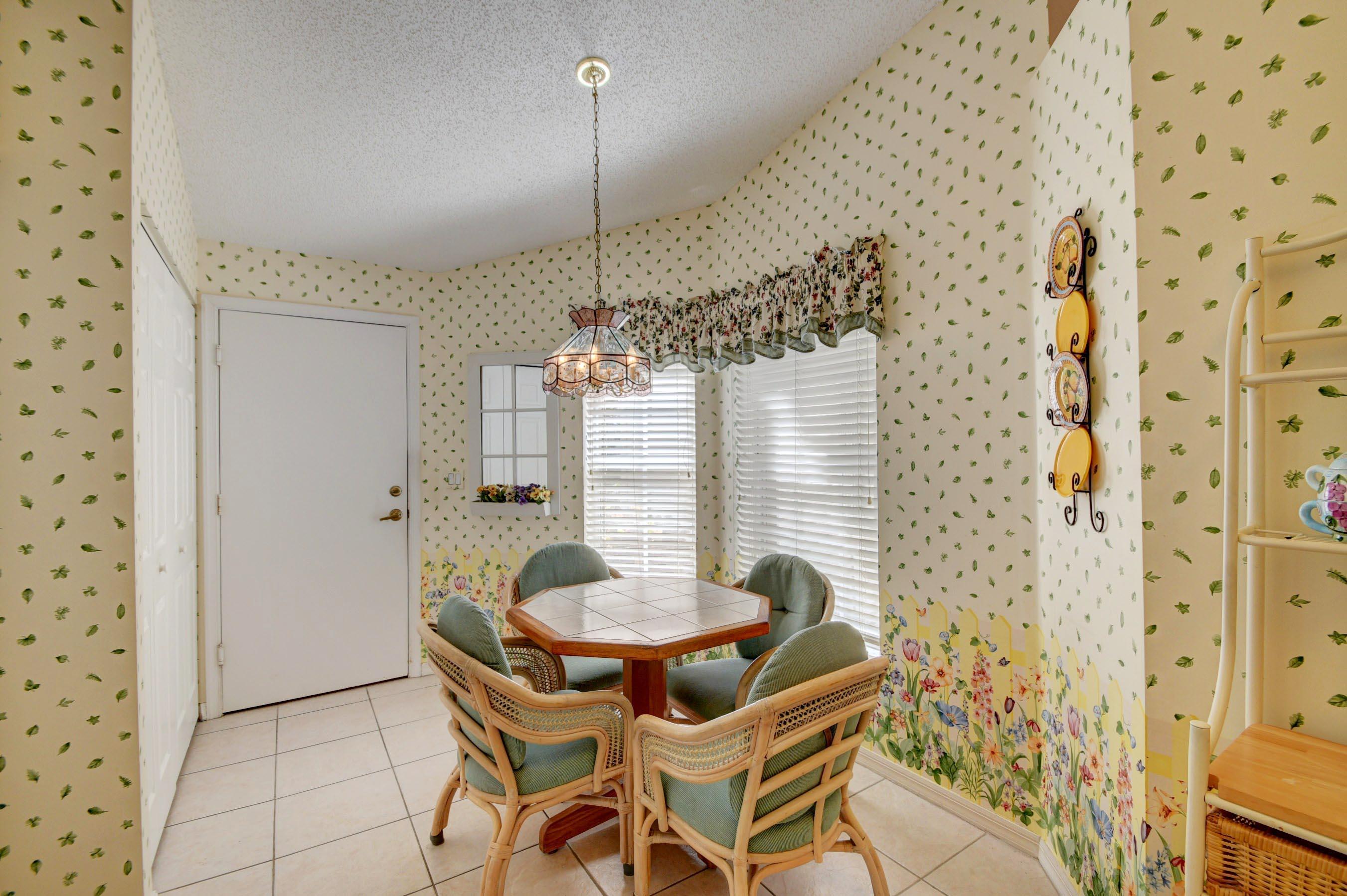 6121 Heliconia Road Delray Beach, FL 33484 - Photo 15 of 49 a dining room with furniture and window