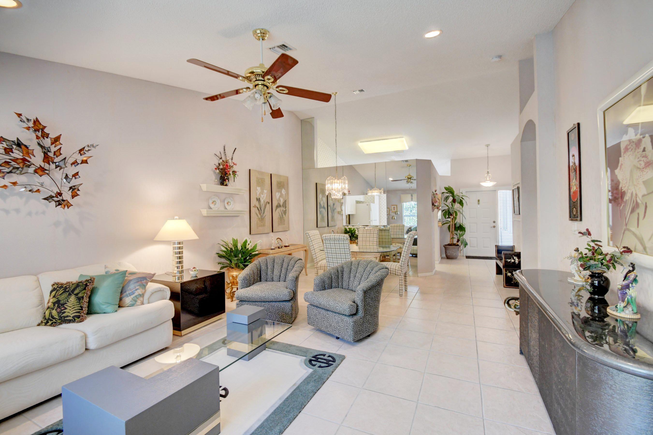 6121 Heliconia Road Delray Beach, FL 33484 - Photo 10 of 49 a living room with furniture