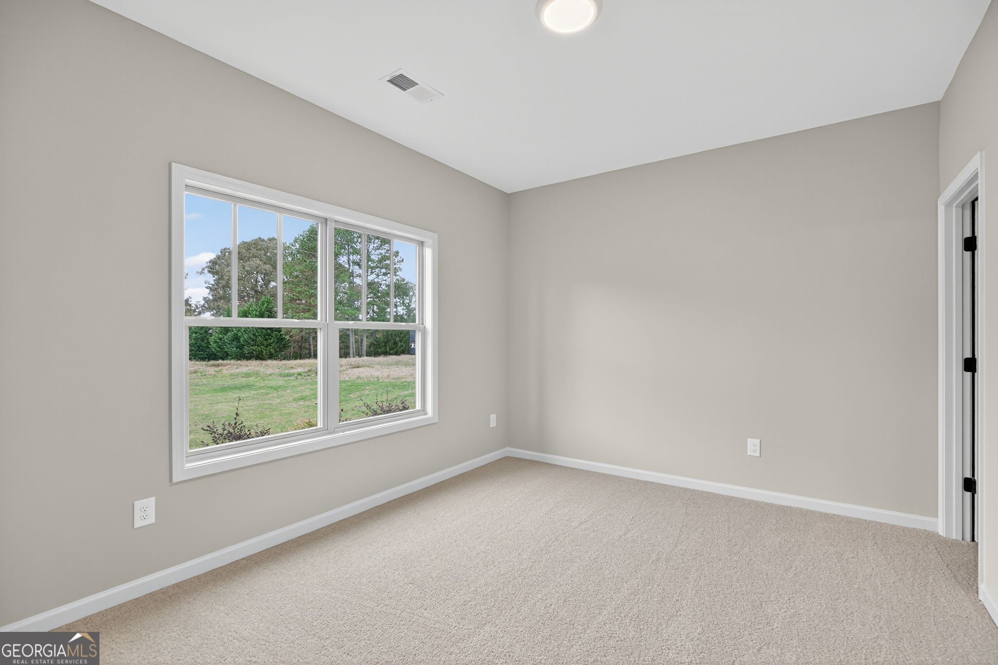 359 Gray Road Roopville, GA 30170 - Photo 24 of 46 a view of an empty room with a window