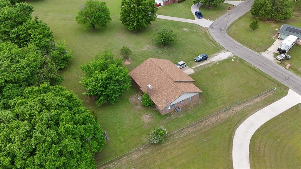 415 Meadowlark Trail Springtown, TX 76082 - Photo 2 of 35 an aerial view of a house with a lake view