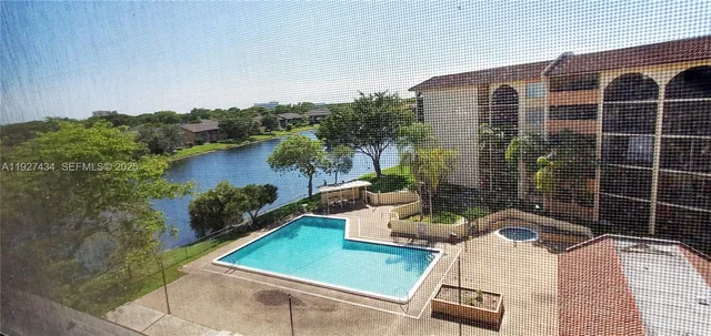 a bathroom with a sink mirror and toilet