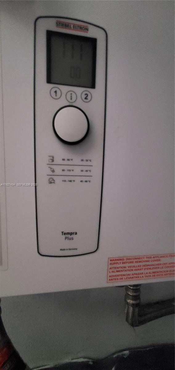 3905 North Nob Hill Road, Unit 510 Sunrise, FL 33351 - Photo 17 of 60 a bathroom with a sink mirror and toilet